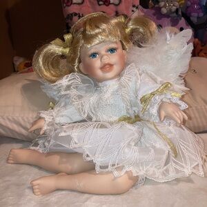 Blonde hair girl porcelain doll angel